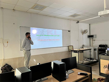 Two men in bicycle jerseys sitting outside at table having coffee